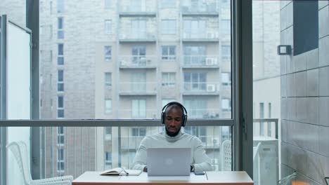 man working from home balcony