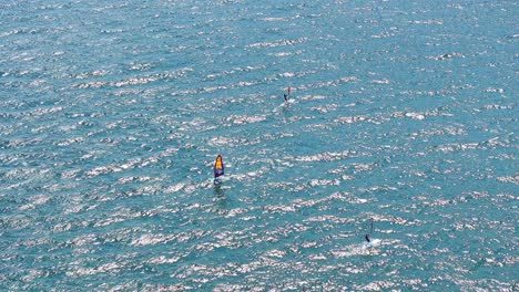 kitesurfing hobbyists at riva del garda italy turquoise waters