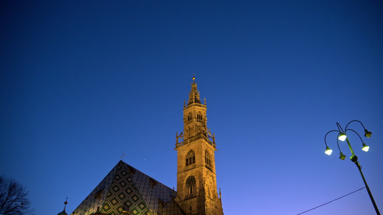 View of the cathedral Maria Himmelfahrt of Bolzano, the Dolomites, Italy in the evening