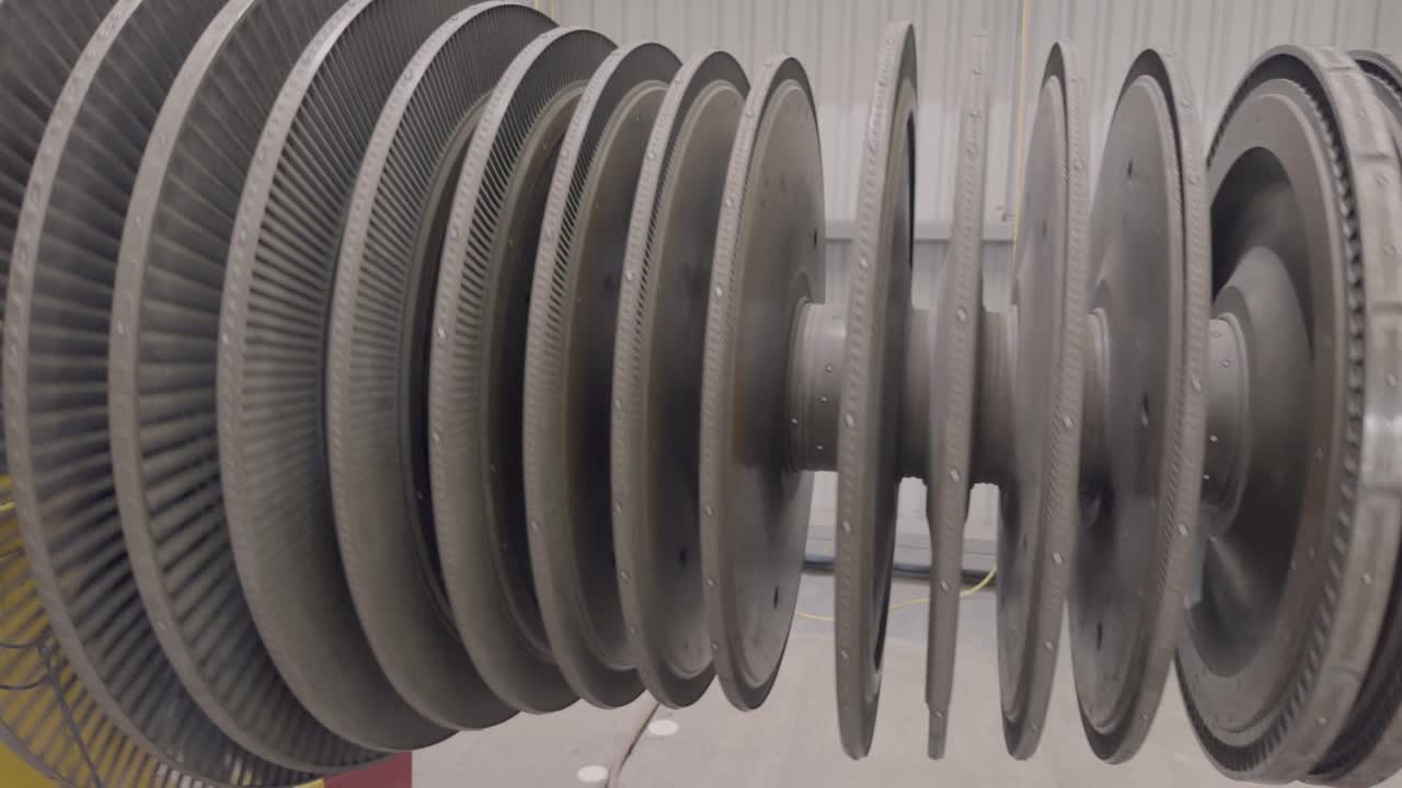 A steam turbine spinning in the open