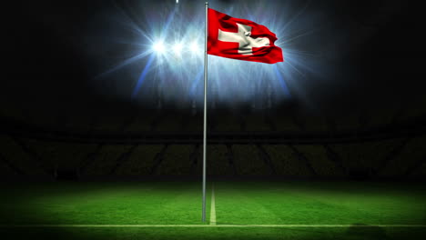 Swiss-national-flag-waving-on-flagpole