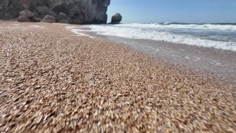 Relax-and-enjoy-the-tranquil-shoreline-where-waves-meet-the-sandy-beaches-of-Crimea,-showcasing-the-natural-beauty-of-the-Sea-of-Azov