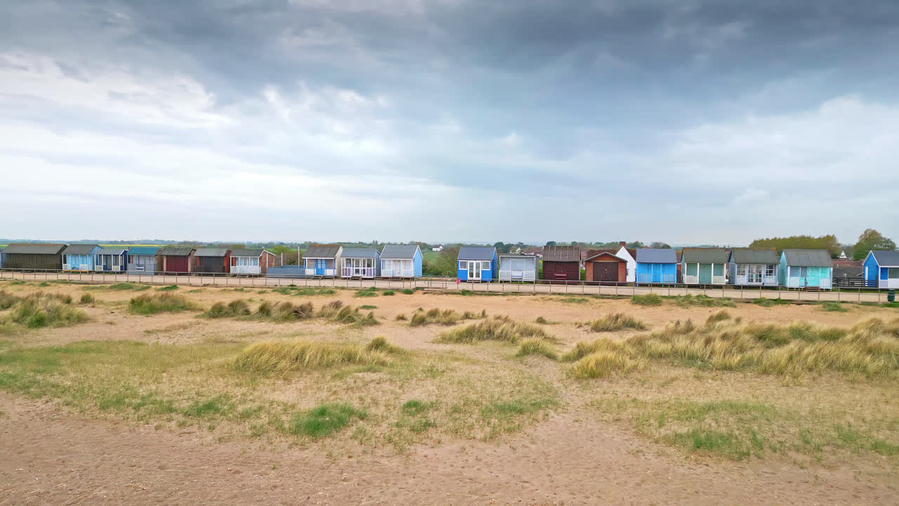 Behold aerial views of Mablethorpe's coastal elegance, showcasing beach huts, sandy beaches, amusement parks, rides, and the vibrant tourists