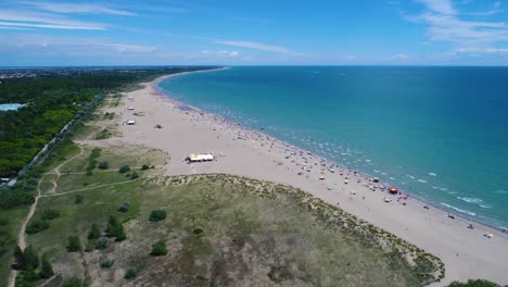 italy, the beach of the adriatic sea. rest on the sea near venice. aerial fpv drone flights.