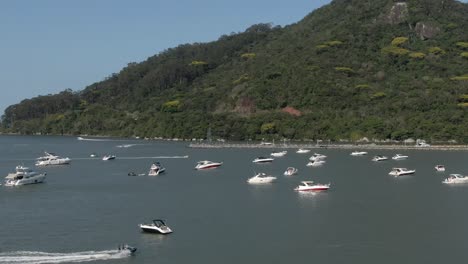 Small-Boats-and-Pleasure-Yachts-in-the-Bay-with-Green-Mountains-AERIAL