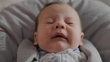 baby-boy-sneezing-in-high-chair