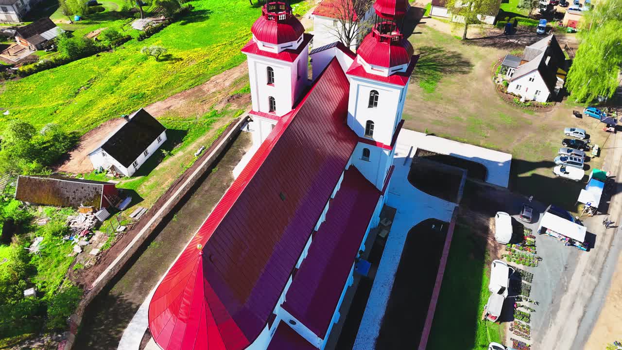 Drone view of European countryside with masonry church in morning light