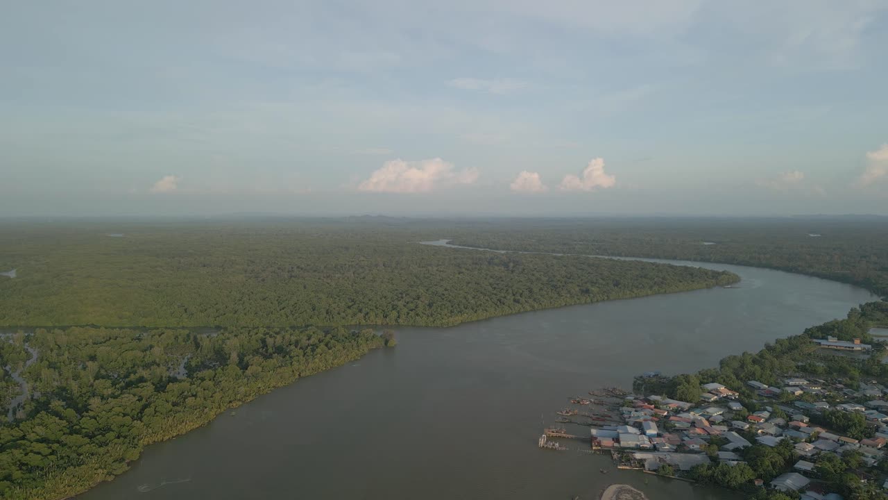 Aerial Drone View During Summer Gerigat Fishing Village,Kabong With, Facing Open Blue Sea, White Sandy Beach,Green Coconut, Palm Trees,And River,Sarawak,Borneo