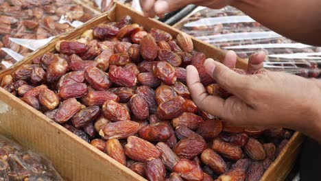 dried dates in wooden box at market