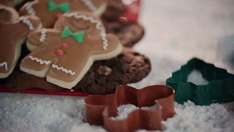 pan across cookie cutters and gingerbread men in a winter wonderland