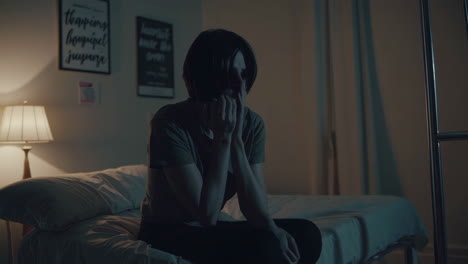 sad woman in a hospital bed