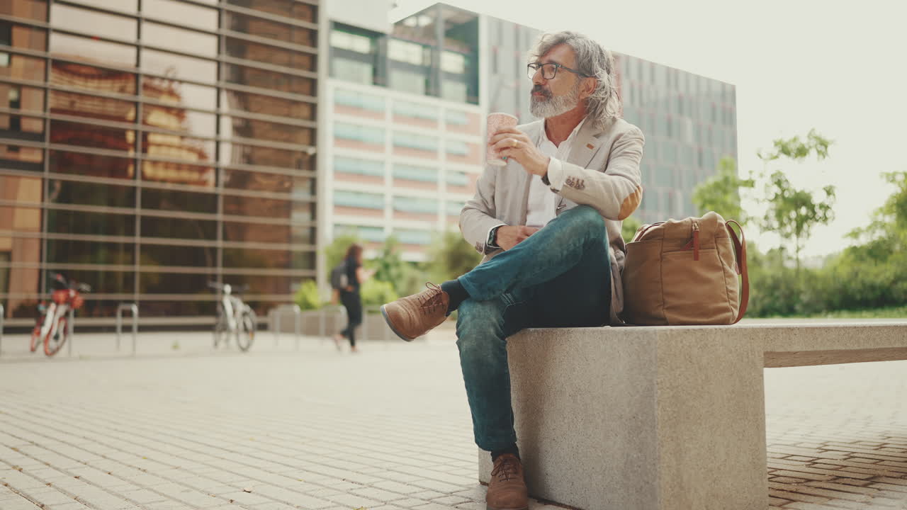 Mature businessman taking a break in the city