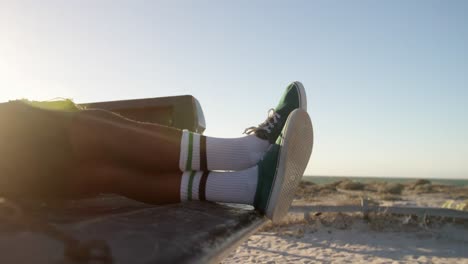 man relaxing in pickup truck at beach 4k