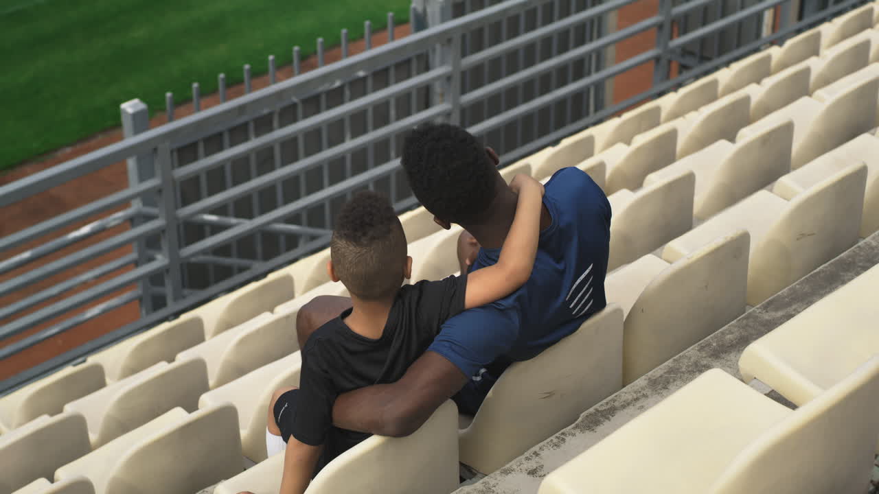 Father and Son at a Sporting Event