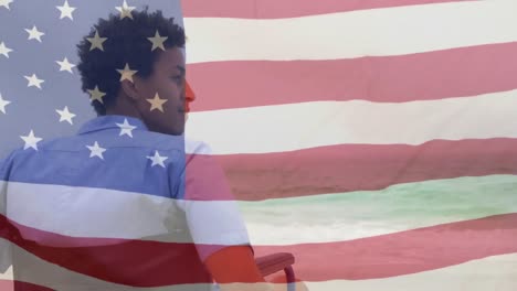 mixed race young disabled man with us flag waving foreground