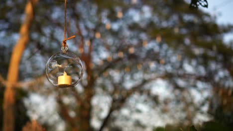 romantic decorative round glass candle light evening sunset party in the garden