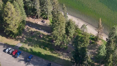 Aerial-Shot-of-the-Recreational-Beach-on-Paul-Lake-by-Kamloops-on-a-sunny-day-in-the-autumn