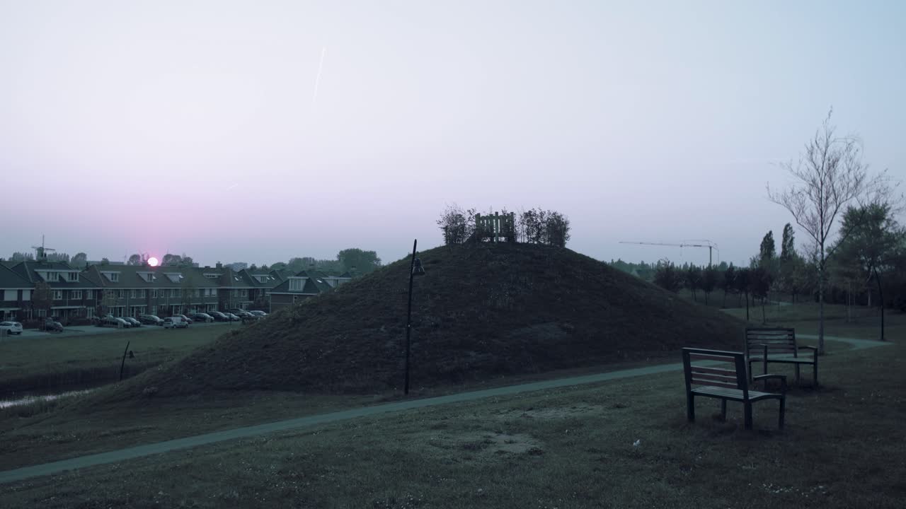 Timelapse of sunset. Visible chemtrails and children playing.