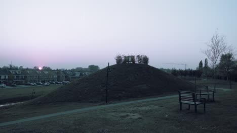 timelapse of sunset. visible chemtrails and children playing.
