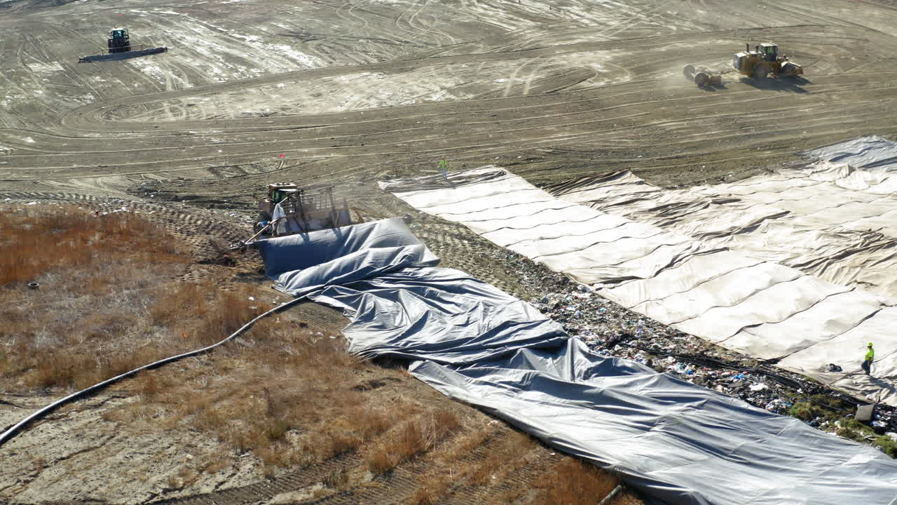 Aerial View of Landfill Operations with Heavy Machinery