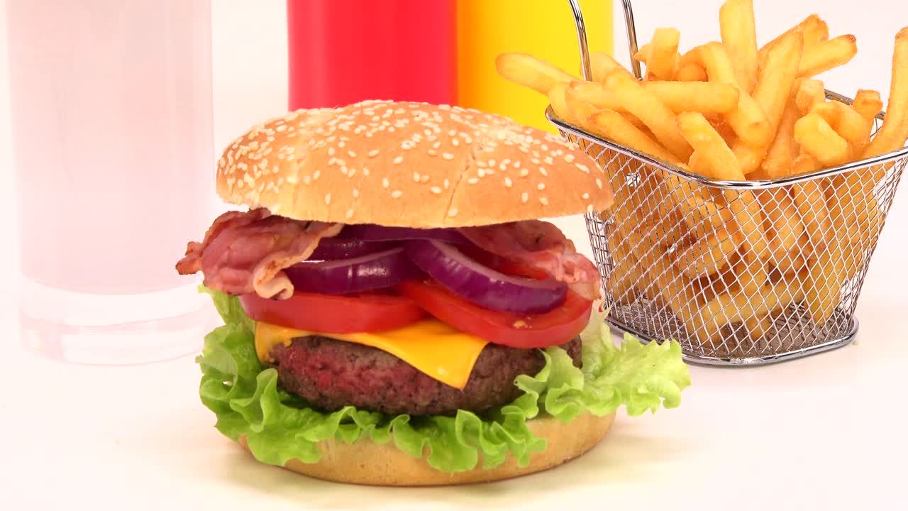 Creation of cheeseburger on white background