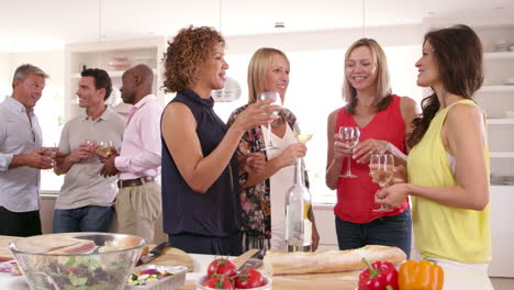 group of mature friends enjoying dinner party shot on r3d