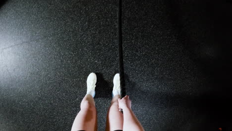 person jumping rope in a gym