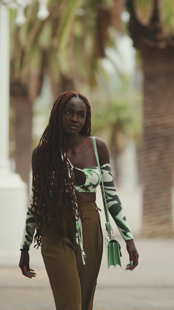 Fashionable woman with long braids