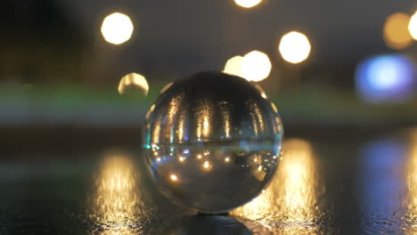 View-of-glass-sphere-imaging-inverted-cityscape-with-road