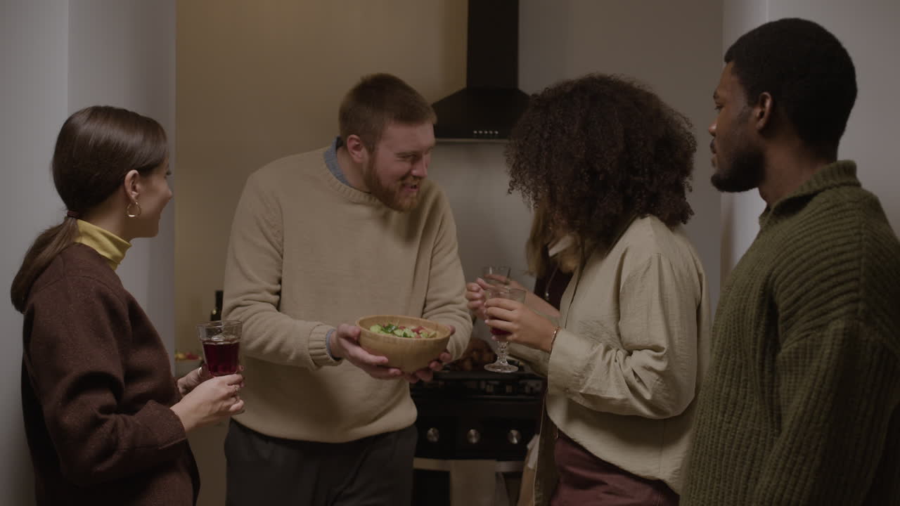 People talking in a kitchen