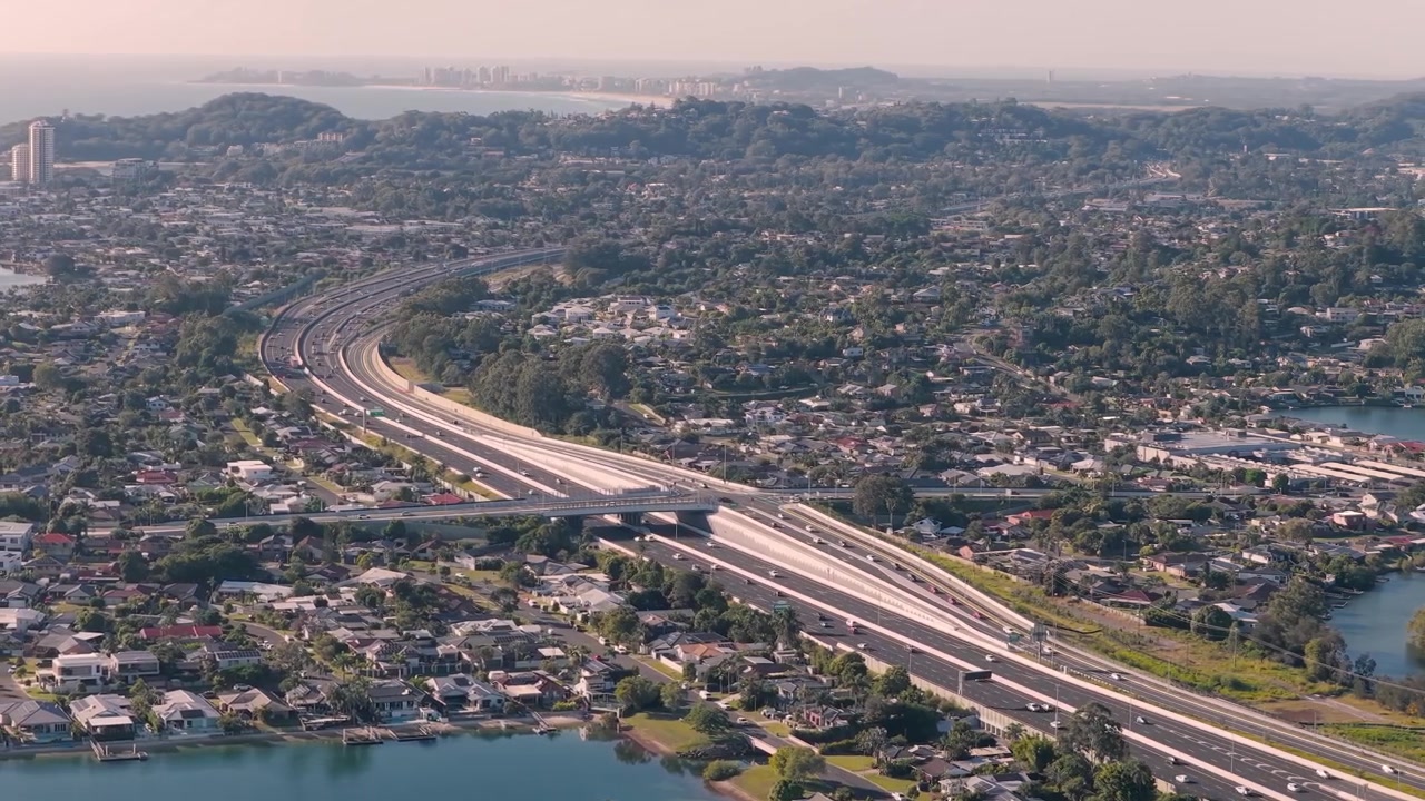 Panoramic Aerial View Of The M1 Pacific Motorway Over The Suburbs In The Gold Coast, QLD, Australia.