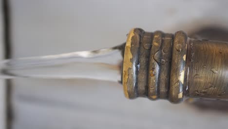 close-up of water flowing from a metal faucet