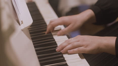 close up of a female hands playing piano 3