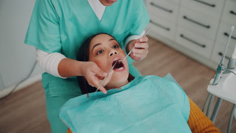 a dentist examining a patient's teeth