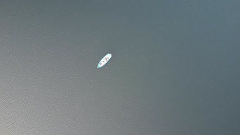 footage of a typical boat in the middle of the magnificent lake of Capolago in 4k