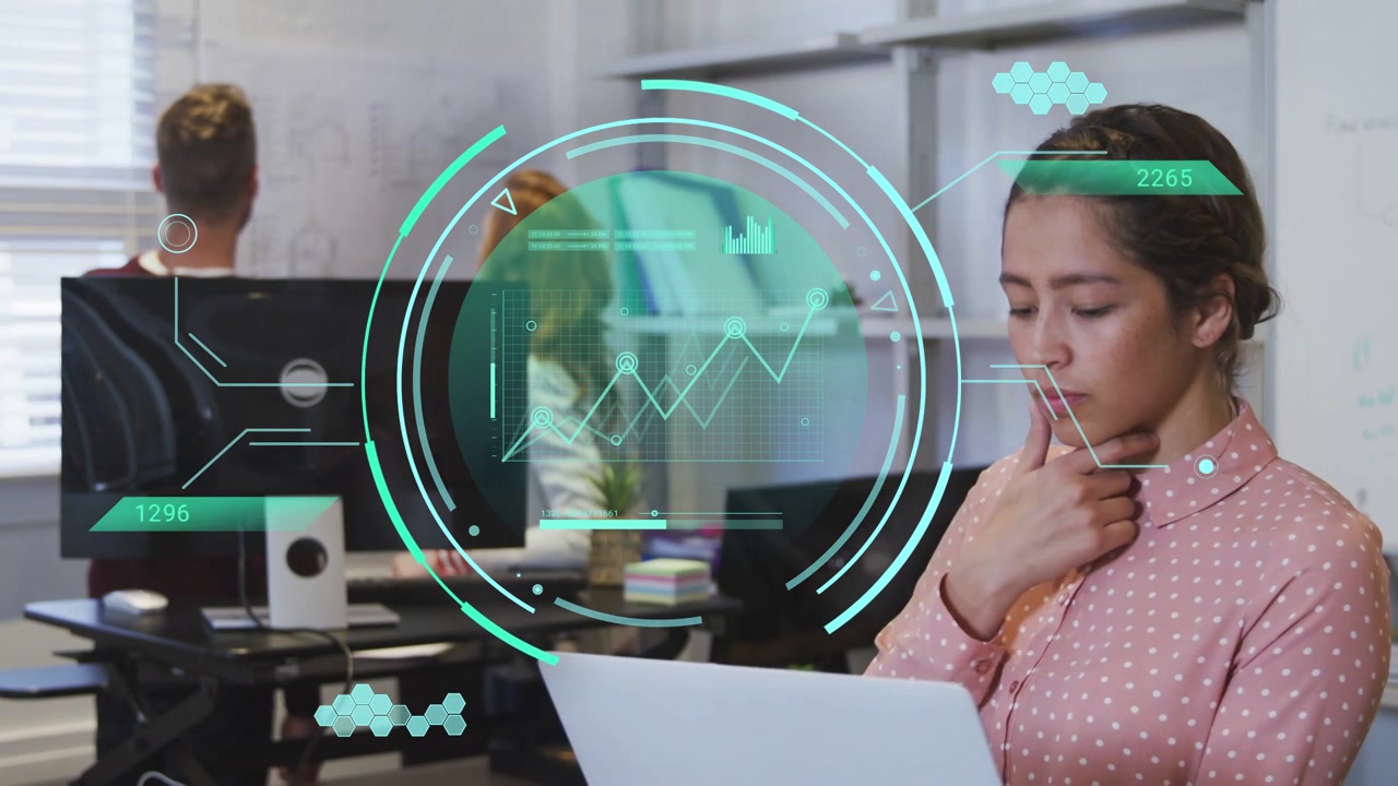 Woman holding document using laptop in office, teal HUD appearing guiding data analysis for plan