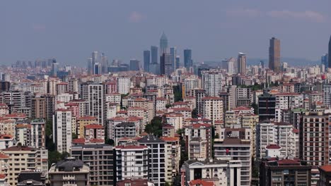 drone flying away from istanbul high rise apartment buildings, modern cityscape