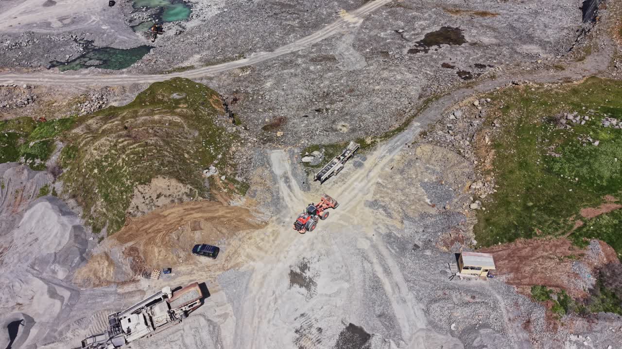 Aerial View of a Stone Quarry with Heavy Machinery and Crushing Equipment