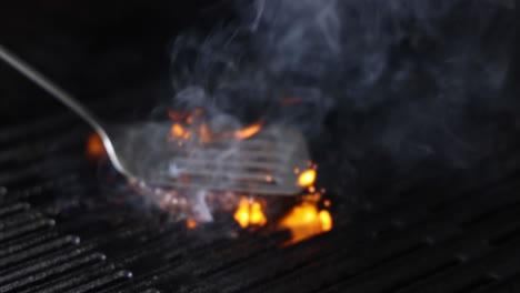 steak catching fire on a hot grill