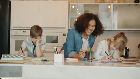 kids doing homework in the kitchen