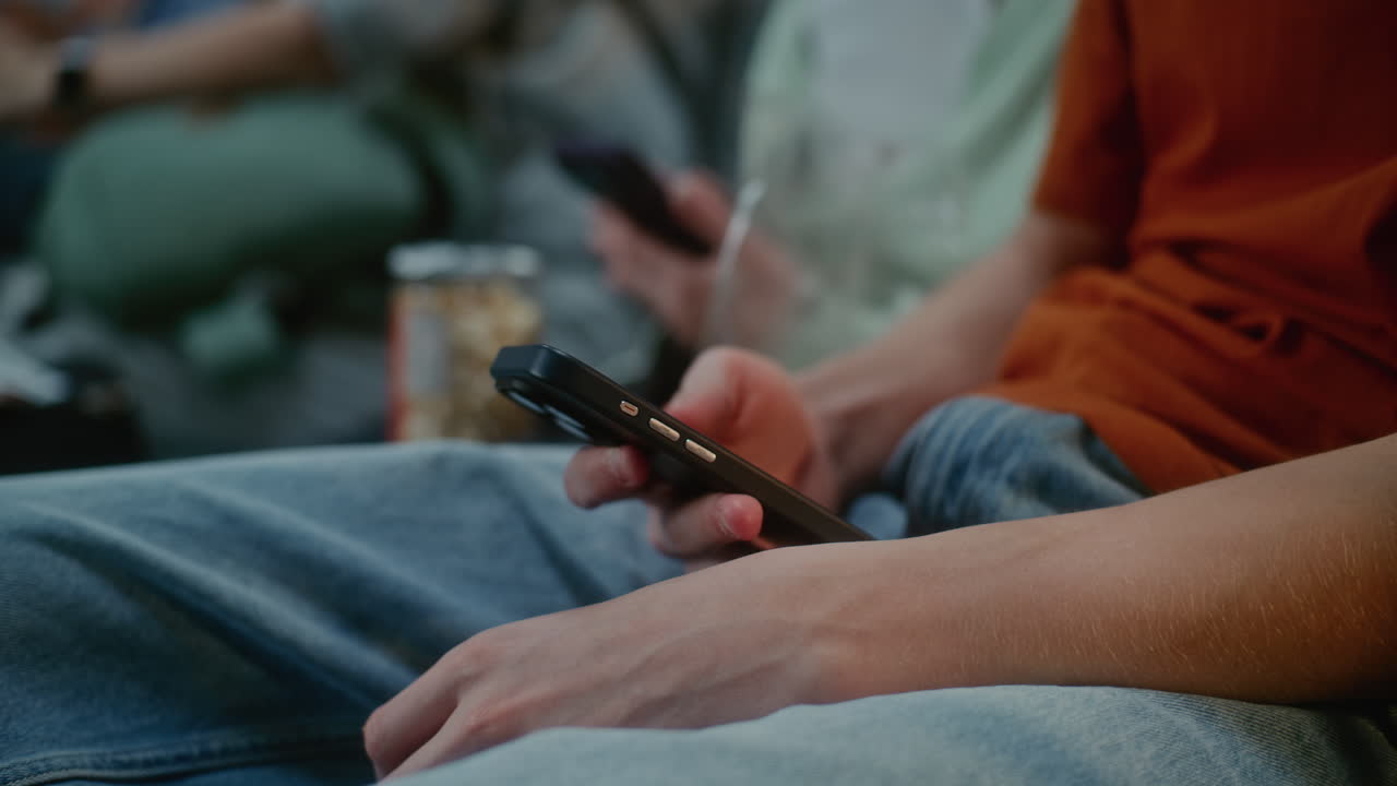 Friends watching a movie in a theater