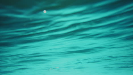 macro closeup of underwater ocean water texture with light illuminating