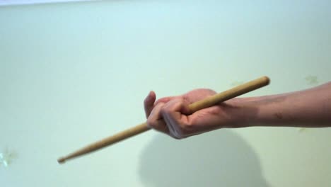 hand throwing chopsticks