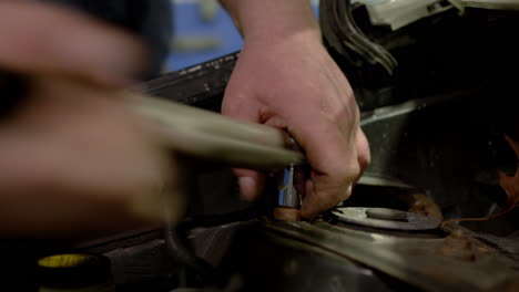 mechanic man examining and maintenance to customer a vehicle car