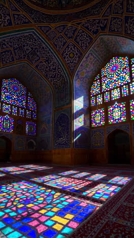 stained glass windows and ornamental architecture of a mosque