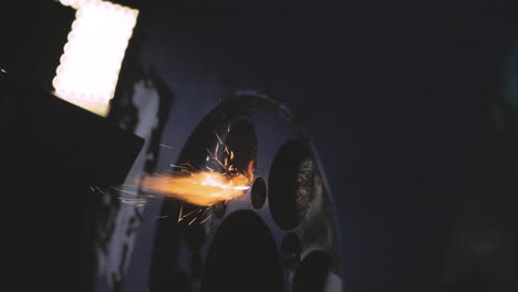 cutting-edge industrial restoration showcasing laser paint removal on a large steel wheel. perfect for manufacturing, engineering, and industrial innovation content. non-contact metal restoration.