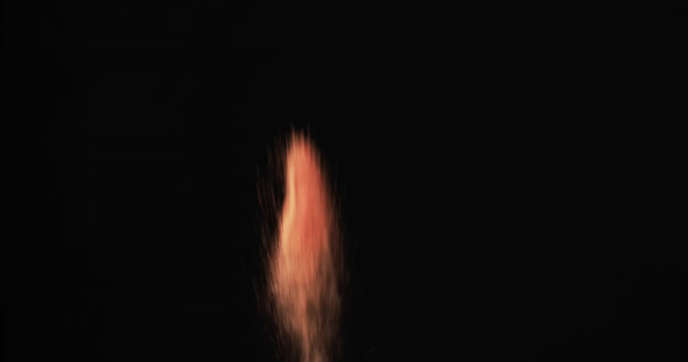 Video of close up of sand grains thrown in the air and copy space on black background