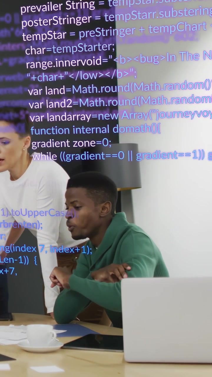 Vertical video: Seated man reaching laptop, woman guiding tech review, code overlay obscuring view