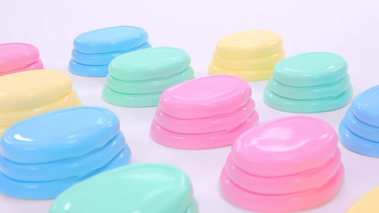 Pastel-colored cosmetic jars stacking and arranging, in white background, with pastel-colored cosmetic jars, from a top-down perspective perspective, with pink, blue accents, nearby objects.