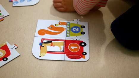 child playing with colorful puzzles with numbers learning to count